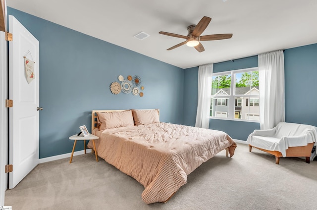 bedroom with visible vents, carpet flooring, ceiling fan, and baseboards