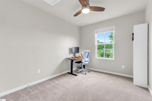 home office with a ceiling fan, carpet flooring, and baseboards