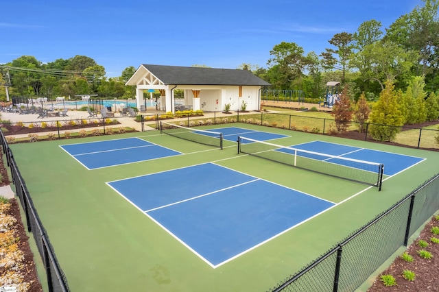 view of sport court featuring community basketball court and fence