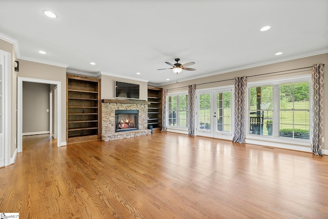 unfurnished living room featuring a ceiling fan, ornamental molding, recessed lighting, and baseboards