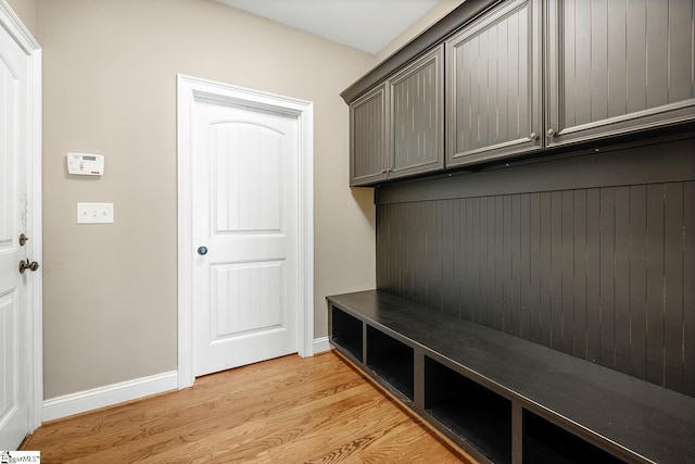 mudroom featuring baseboards and light wood-type flooring