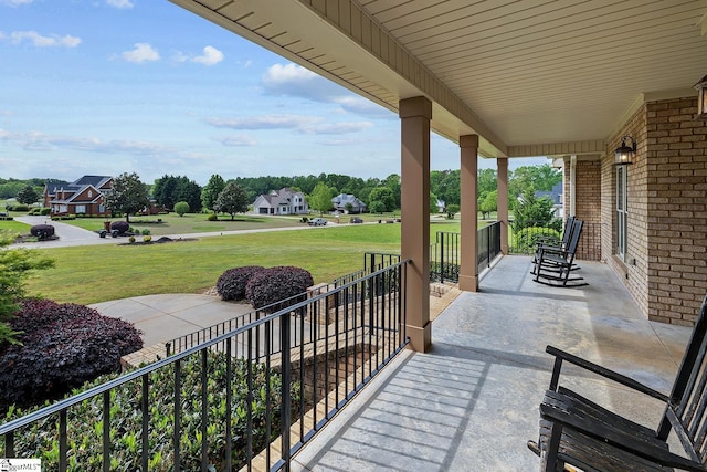 view of patio / terrace with covered porch and a residential view
