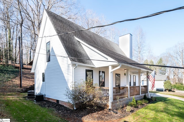 203 W Dr, Travelers Rest, SC 29690 - exterior space with a chimney, central AC, a porch, and a shingled roof