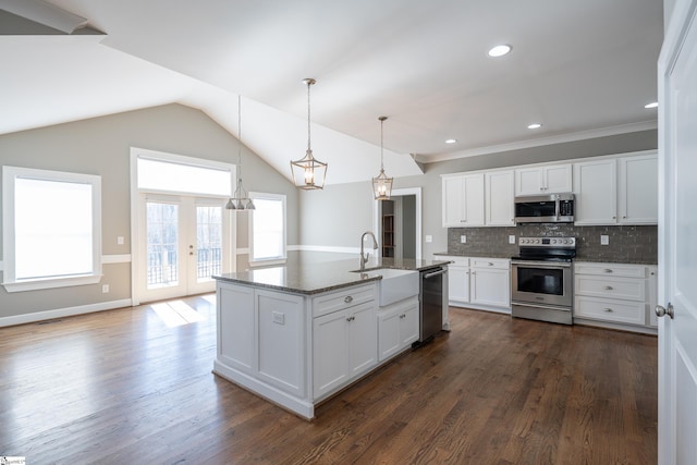 112 Nokota Dr, Pelzer, SC 29669 - kitchen with a sink, dark stone countertops, tasteful backsplash, white cabinetry, and appliances with stainless steel finishes