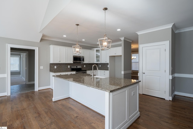 112 Nokota Dr, Pelzer, SC 29669 - kitchen with ornamental molding, white cabinets, stainless steel appliances, and an island with sink