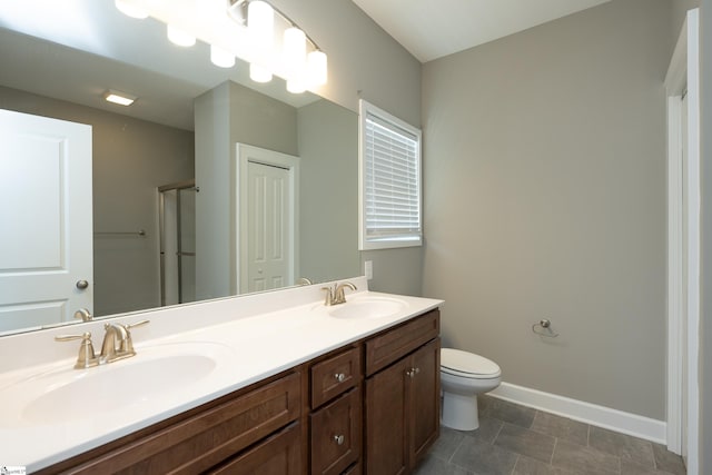 112 Nokota Dr, Pelzer, SC 29669 - bathroom featuring toilet, double vanity, a sink, and baseboards