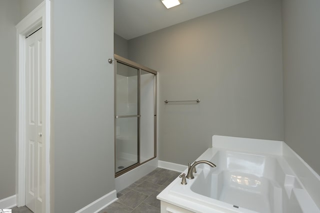 112 Nokota Dr, Pelzer, SC 29669 - full bathroom with a bath, a stall shower, and baseboards