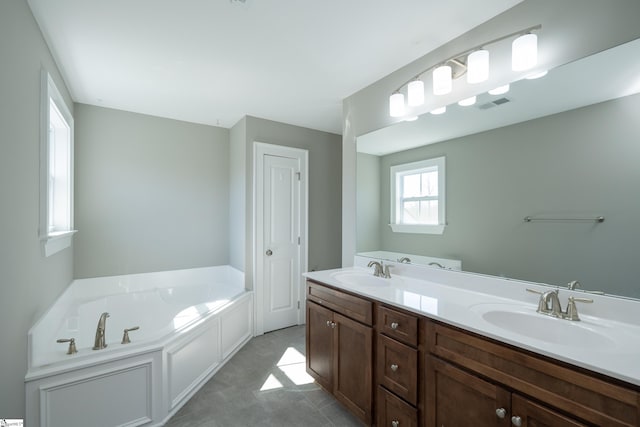 112 Nokota Dr, Pelzer, SC 29669 - full bath featuring a garden tub, double vanity, a sink, and visible vents