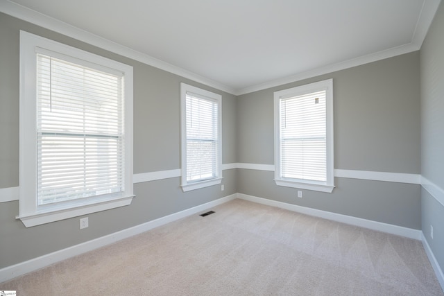 112 Nokota Dr, Pelzer, SC 29669 - empty room featuring crown molding, visible vents, light colored carpet, and baseboards