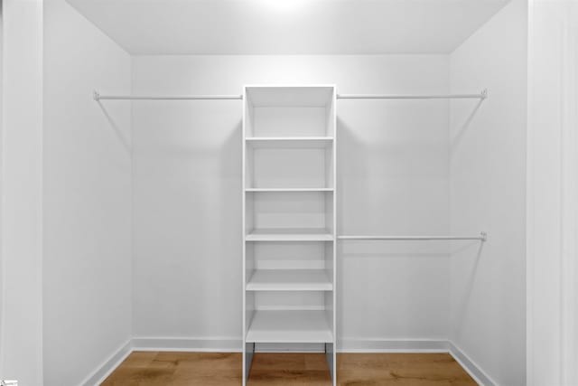 spacious closet with wood finished floors