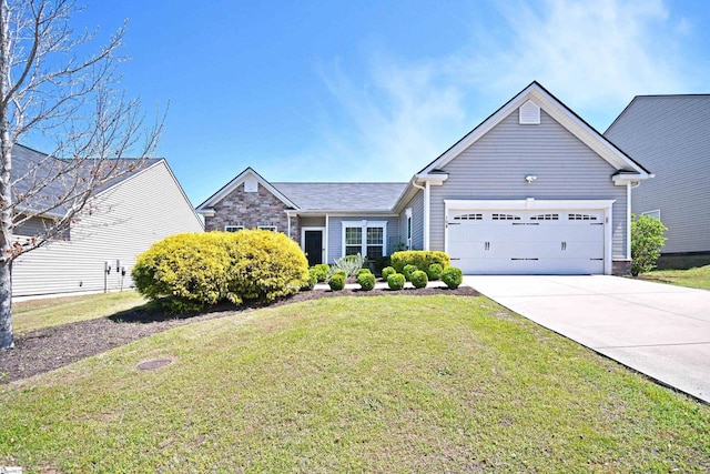 ranch-style home featuring a front yard, driveway, and a garage
