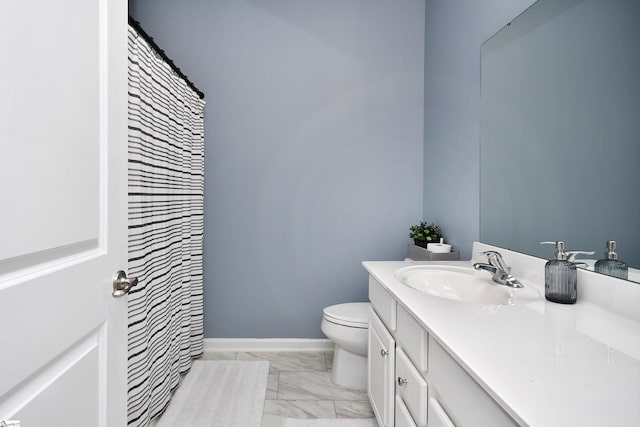 full bath with a shower with curtain, vanity, toilet, marble finish floor, and baseboards