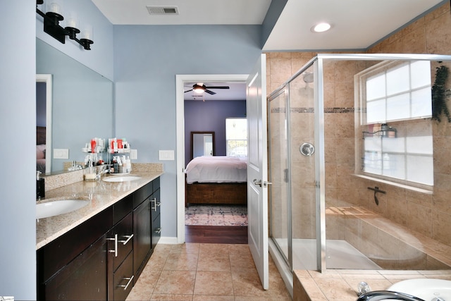 ensuite bathroom featuring a sink, connected bathroom, a stall shower, visible vents, and tile patterned flooring