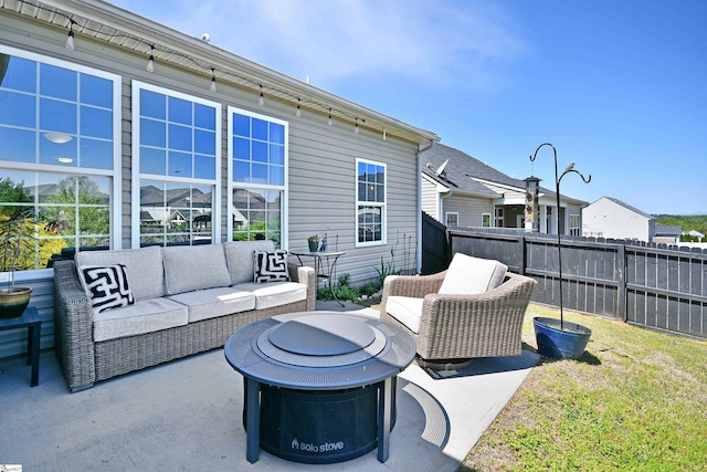 view of patio / terrace featuring fence and an outdoor hangout area