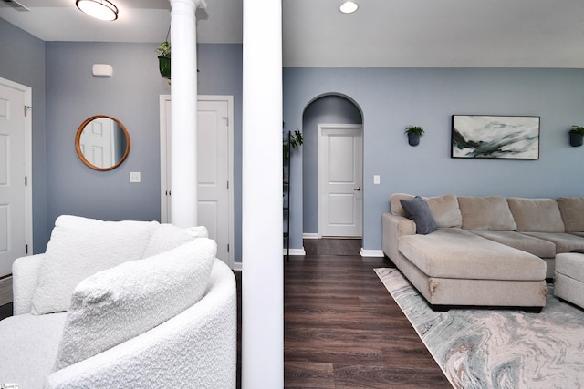living room with baseboards, recessed lighting, and dark wood-type flooring