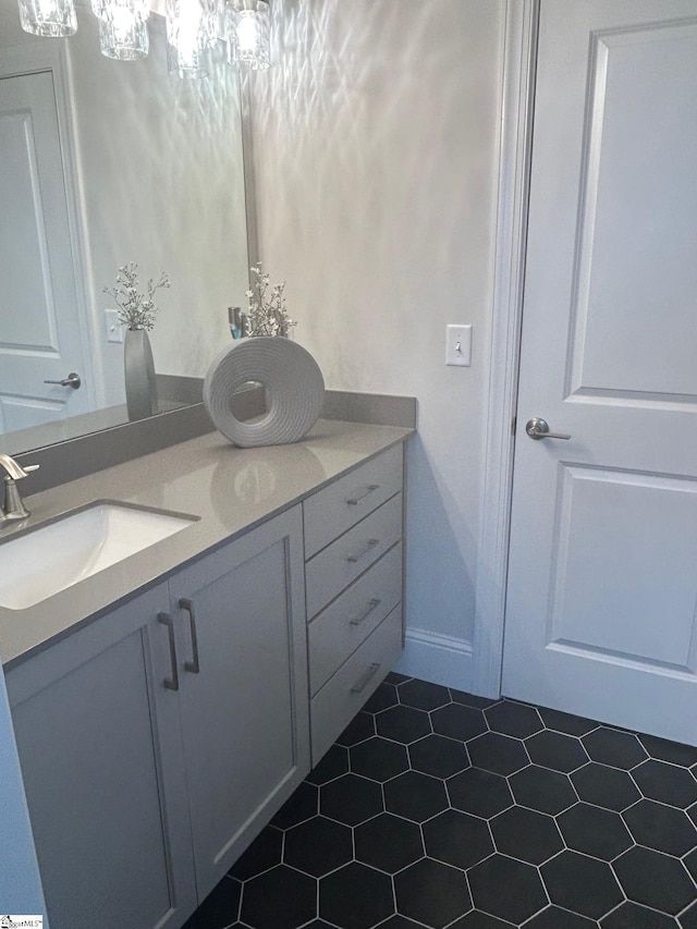 bathroom featuring tile patterned flooring and vanity