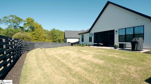 view of yard featuring fence and a patio area