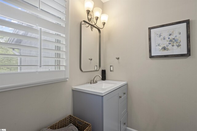 2 Graystone Way, Taylors, SC 29687 - bathroom featuring a notable chandelier and vanity