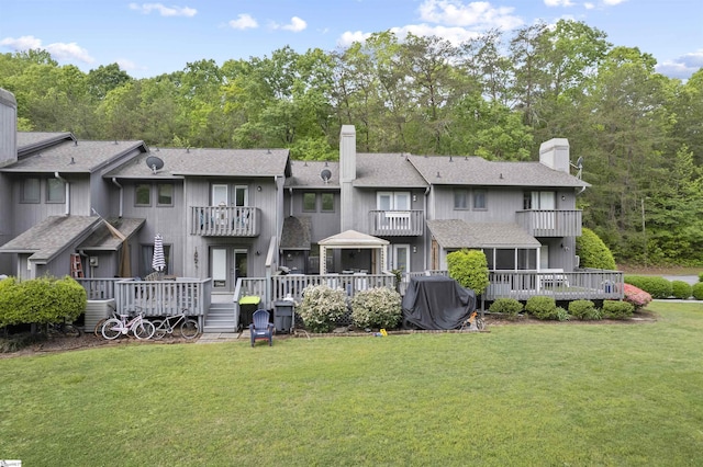 2 Graystone Way, Taylors, SC 29687 - rear view of house with a lawn, a wooden deck, a chimney, and a balcony