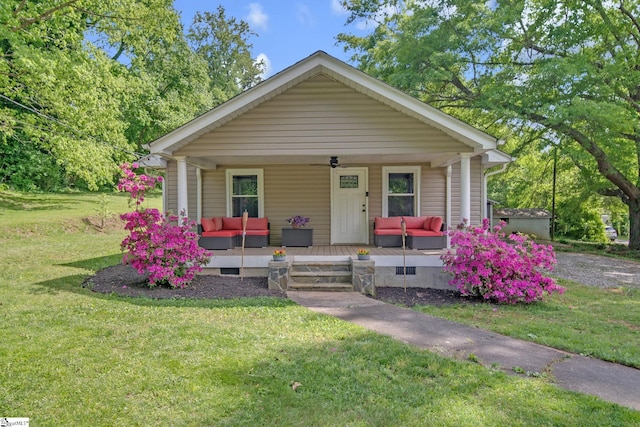bungalow-style house with an outdoor hangout area and a front yard