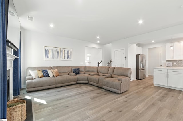229 Hollythorpe Ln, Fountain Inn, SC 29644 - living area with visible vents, light wood-style floors, and recessed lighting