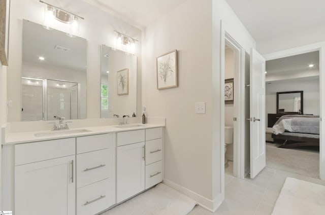 229 Hollythorpe Ln, Fountain Inn, SC 29644 - ensuite bathroom with toilet, a stall shower, a sink, and baseboards