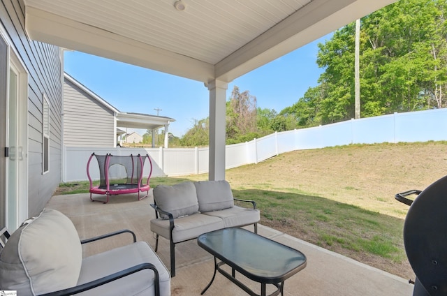 229 Hollythorpe Ln, Fountain Inn, SC 29644 - view of patio featuring an outdoor living space, a trampoline, and a fenced backyard