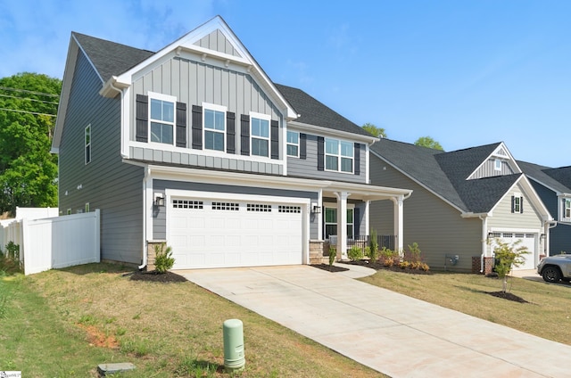 229 Hollythorpe Ln, Fountain Inn, SC 29644 - craftsman-style house featuring board and batten siding, concrete driveway, an attached garage, fence, and a porch