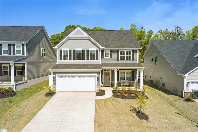 229 Hollythorpe Ln, Fountain Inn, SC 29644 - view of front of property with a front lawn, covered porch, board and batten siding, concrete driveway, and an attached garage