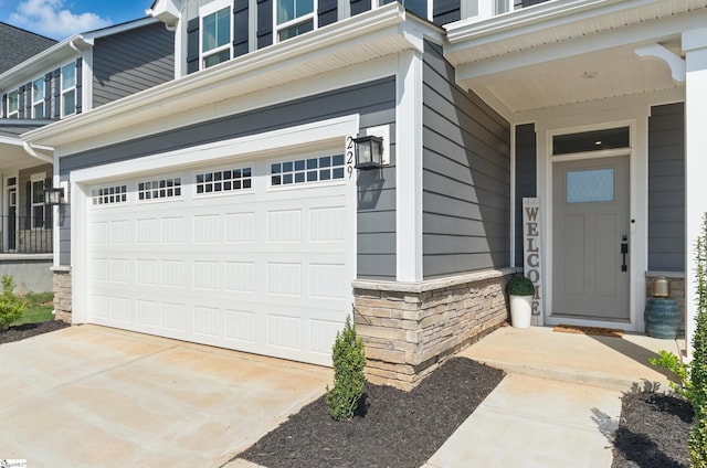 229 Hollythorpe Ln, Fountain Inn, SC 29644 - view of exterior entry featuring an attached garage and stone siding