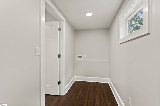 hall with baseboards and wood finished floors