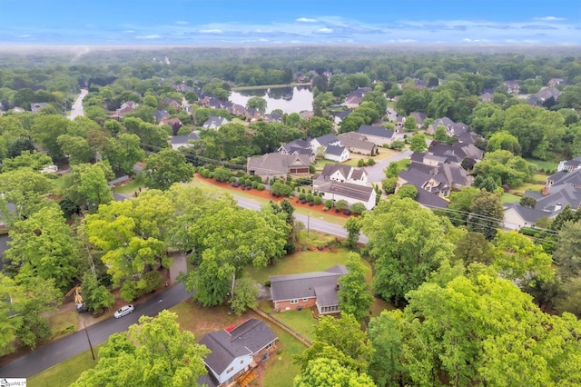 birds eye view of property featuring a water view and a residential view