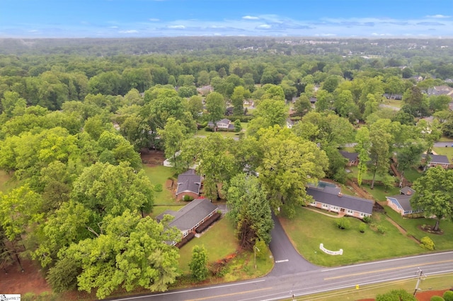drone / aerial view featuring a forest view