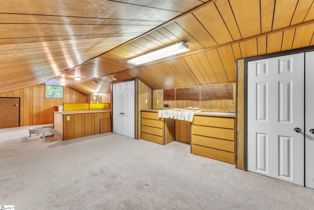 bonus room featuring wood walls, light carpet, wood ceiling, and vaulted ceiling