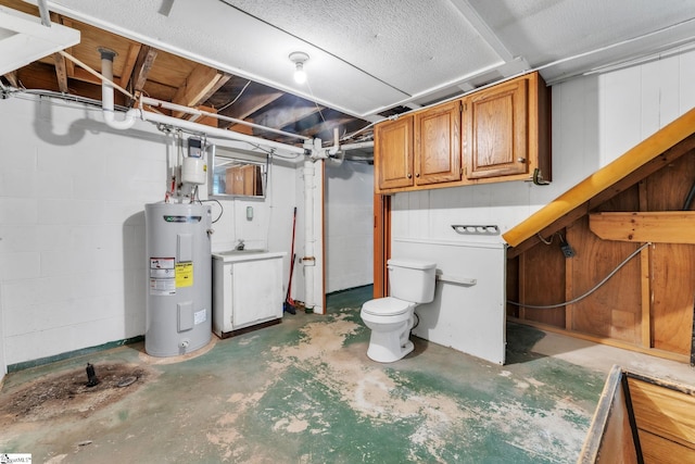 unfinished basement featuring a sink and water heater