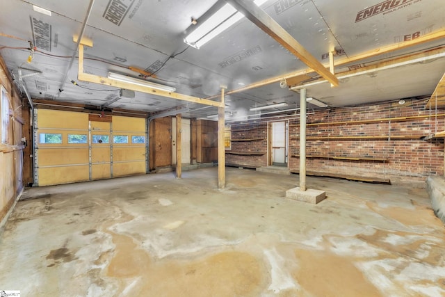 below grade area with visible vents and brick wall