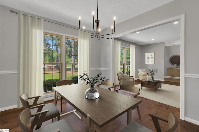 dining room featuring recessed lighting, a notable chandelier, and dark wood-type flooring