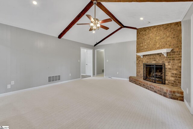 unfurnished living room with lofted ceiling with beams, a ceiling fan, visible vents, and baseboards