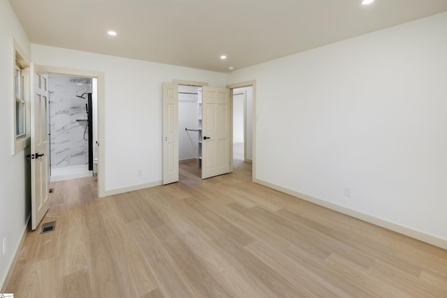 unfurnished bedroom featuring visible vents, recessed lighting, light wood-type flooring, and baseboards