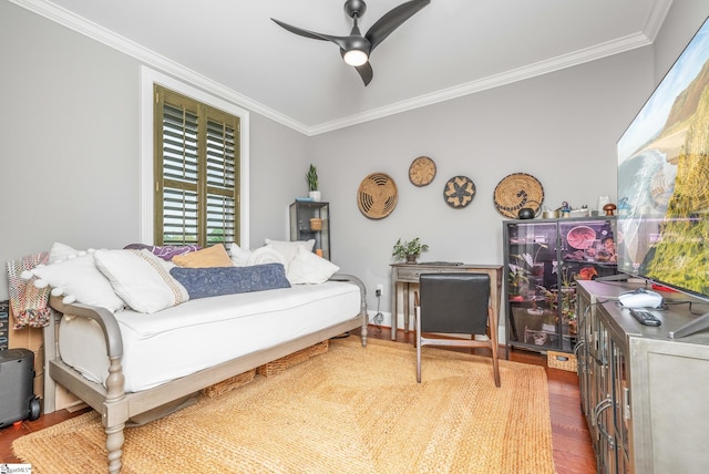 bedroom featuring wood finished floors, ceiling fan, and ornamental molding