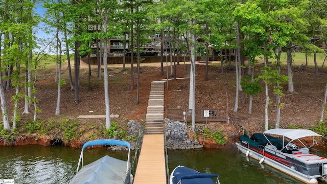 dock area featuring a water view and stairway