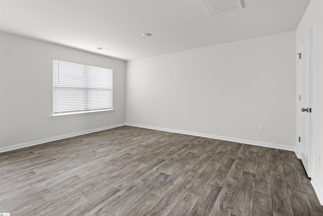 1228 Nnorwhich Ln, Spartanburg, SC 29301 - empty room with visible vents, baseboards, and dark wood finished floors