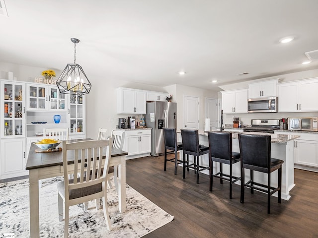 1087 Summerlin Trl, Duncan, SC 29334 - dining room with dark wood finished floors, recessed lighting, visible vents, and a notable chandelier