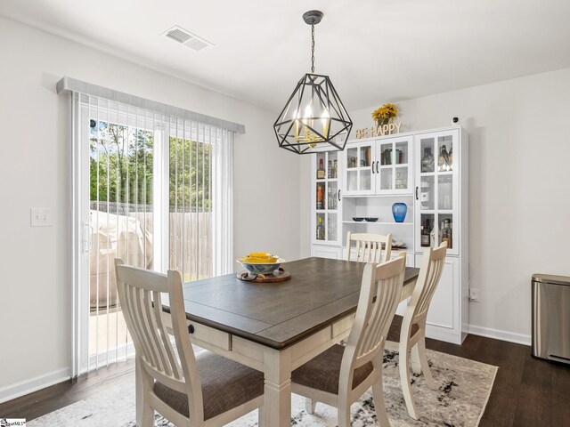 1087 Summerlin Trl, Duncan, SC 29334 - dining space featuring visible vents, a chandelier, dark wood-style floors, and baseboards