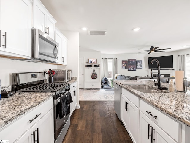 1087 Summerlin Trl, Duncan, SC 29334 - kitchen featuring a sink, a ceiling fan, visible vents, appliances with stainless steel finishes, and open floor plan