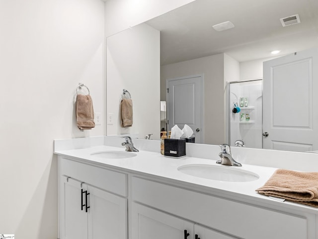1087 Summerlin Trl, Duncan, SC 29334 - bathroom with visible vents, a shower stall, double vanity, and a sink