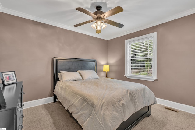 bedroom featuring ornamental molding, visible vents, carpet flooring, and baseboards