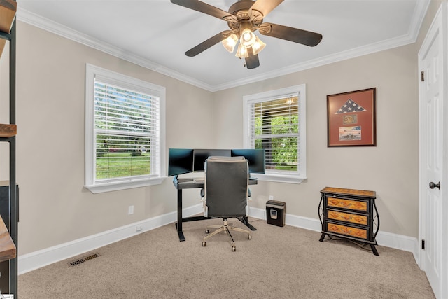 carpeted office space featuring visible vents, ceiling fan, ornamental molding, and baseboards
