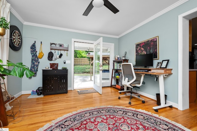 home office featuring crown molding, a ceiling fan, wood finished floors, and baseboards