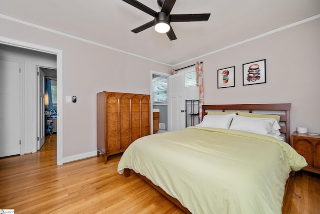 bedroom with ceiling fan, light wood-type flooring, ornamental molding, and baseboards